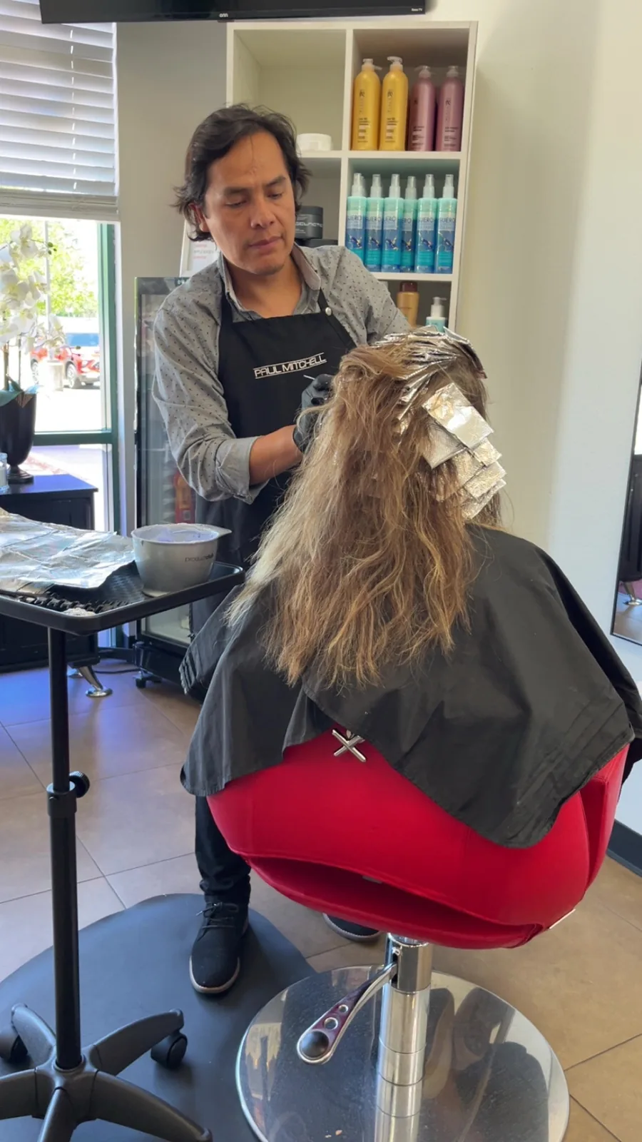 Jorge applying foils for a full highlight in the salon