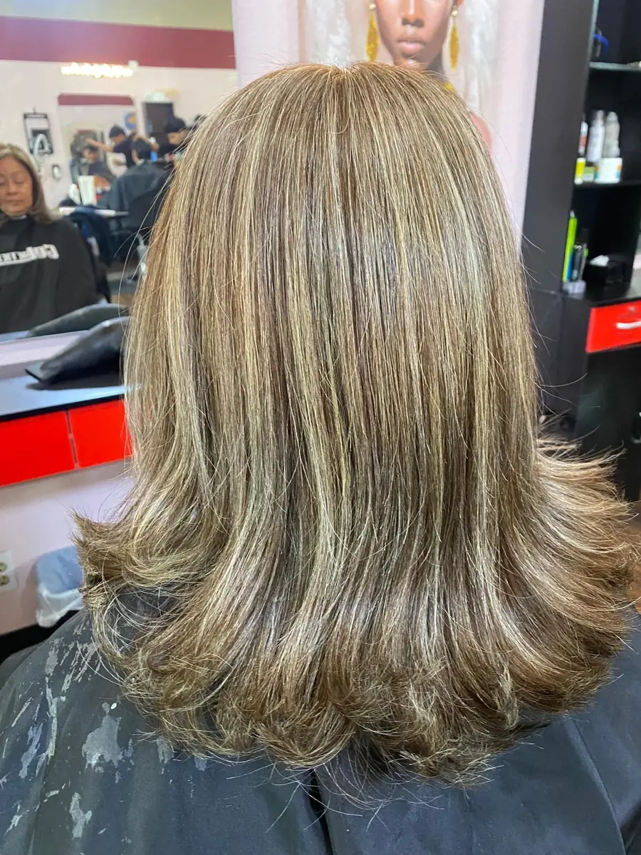 Caramel highlights blended through a layered blowout